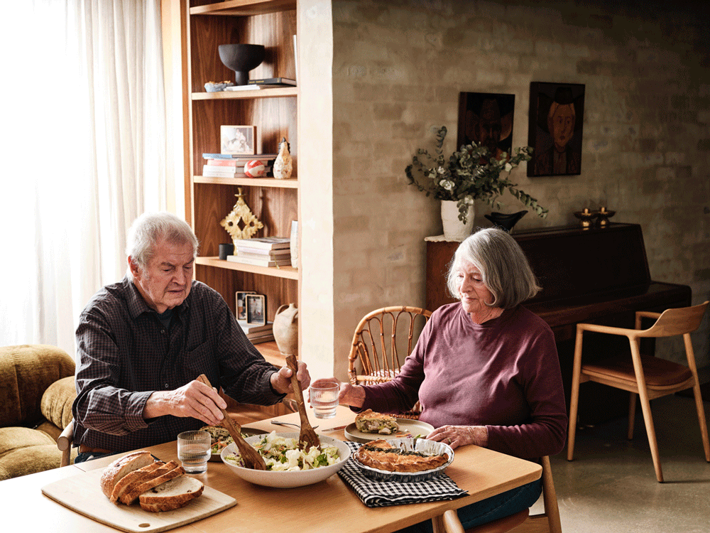 Elderly couple eating dinner